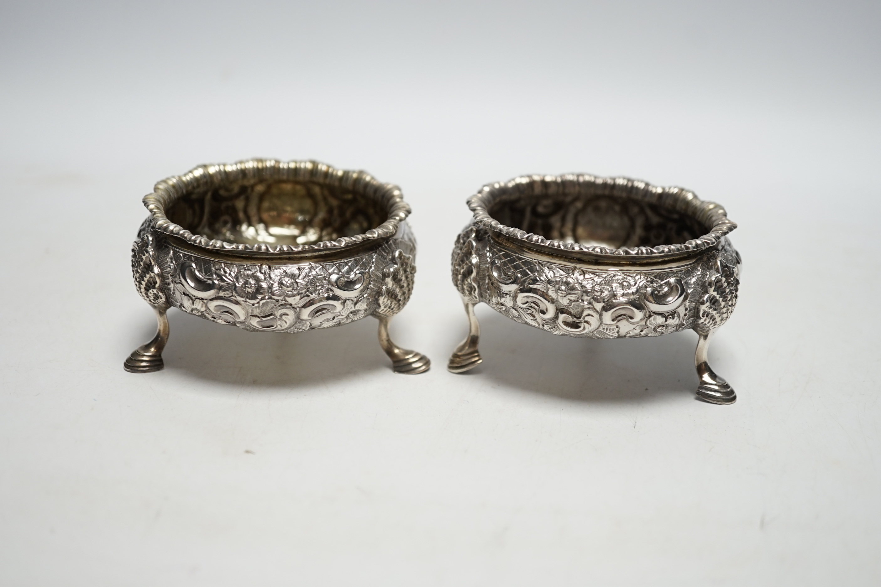 A pair of Victorian embossed silver bun salts, London, 1848, diameter 75mm.